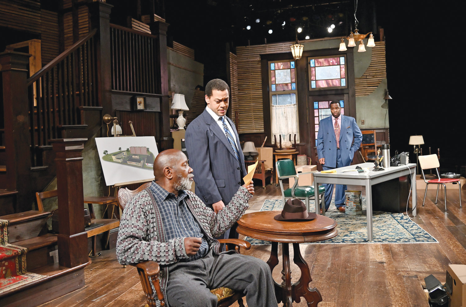 Ricardo Pitts-Wiley (front) as Elder Joseph Barlow, Joe Wilson Jr. as Harmond Wilks and Omar Robinson as Roosevelt Hicks. Directed by Jude Sandy. Set design by Michael McGarty and Baron E. Pugh, costume design by Yao Chen, lighting design by Amith Chandrashaker and sound design by Larry D. Fowler Jr.